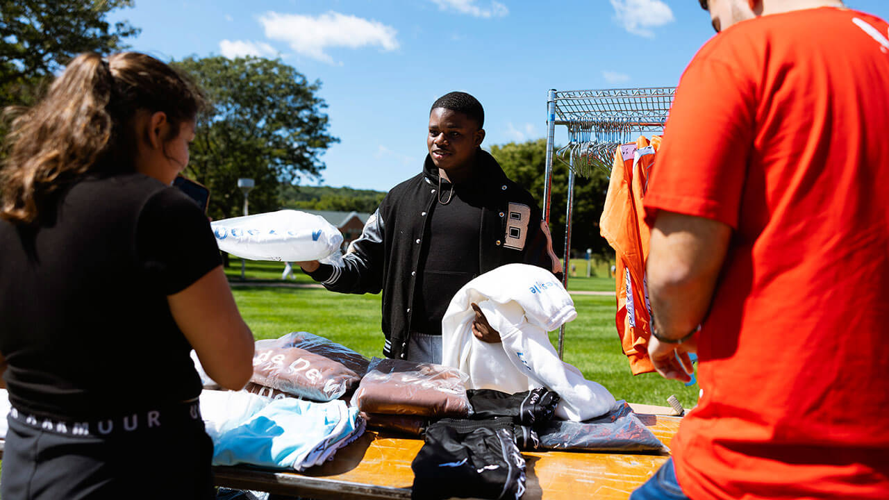 Dior Barnes sells his fashion pieces on the Quad during a pop-up-event