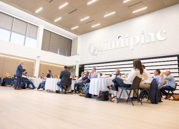 Quinnipiac community members gathered for an event in the School of Business Auditorium