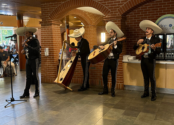A mariachi band performs in the Mount Carmel Dining Hall.