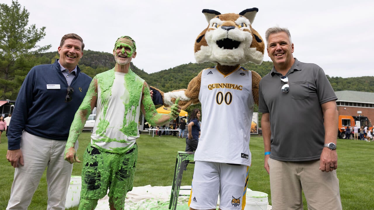 Tom Ellet takes a picture with Boomer.