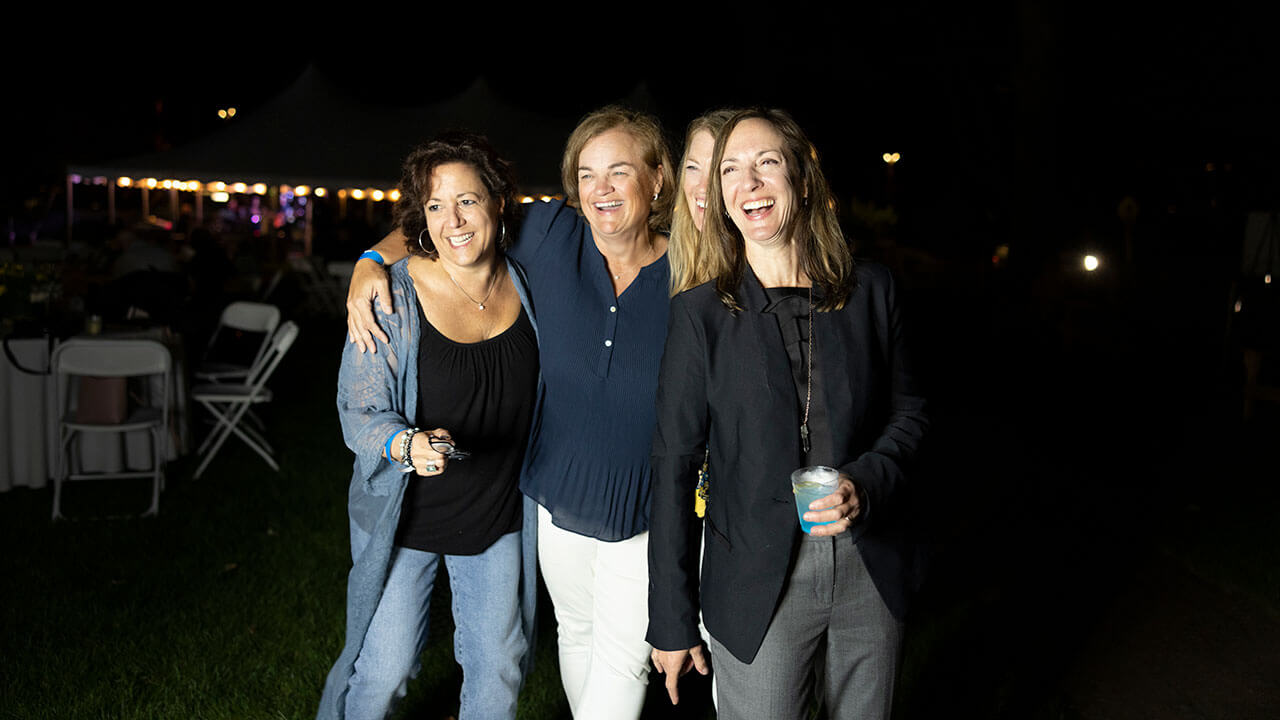 Alumnae smile for a group photo