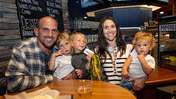 A Quinnipiac Alumni couple and their family enjoy an event at On the Rocks on the York Hill campus.