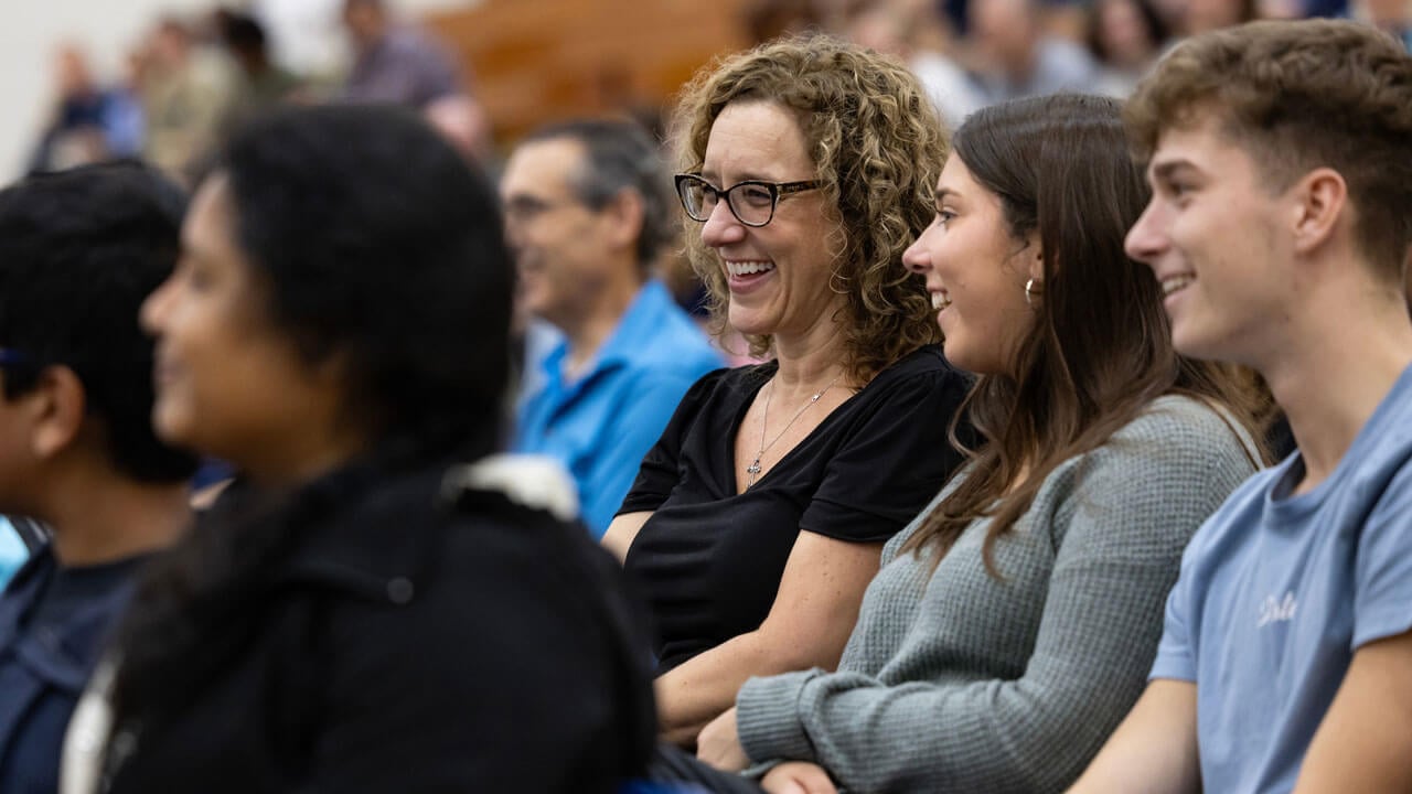 Parent and students laughing