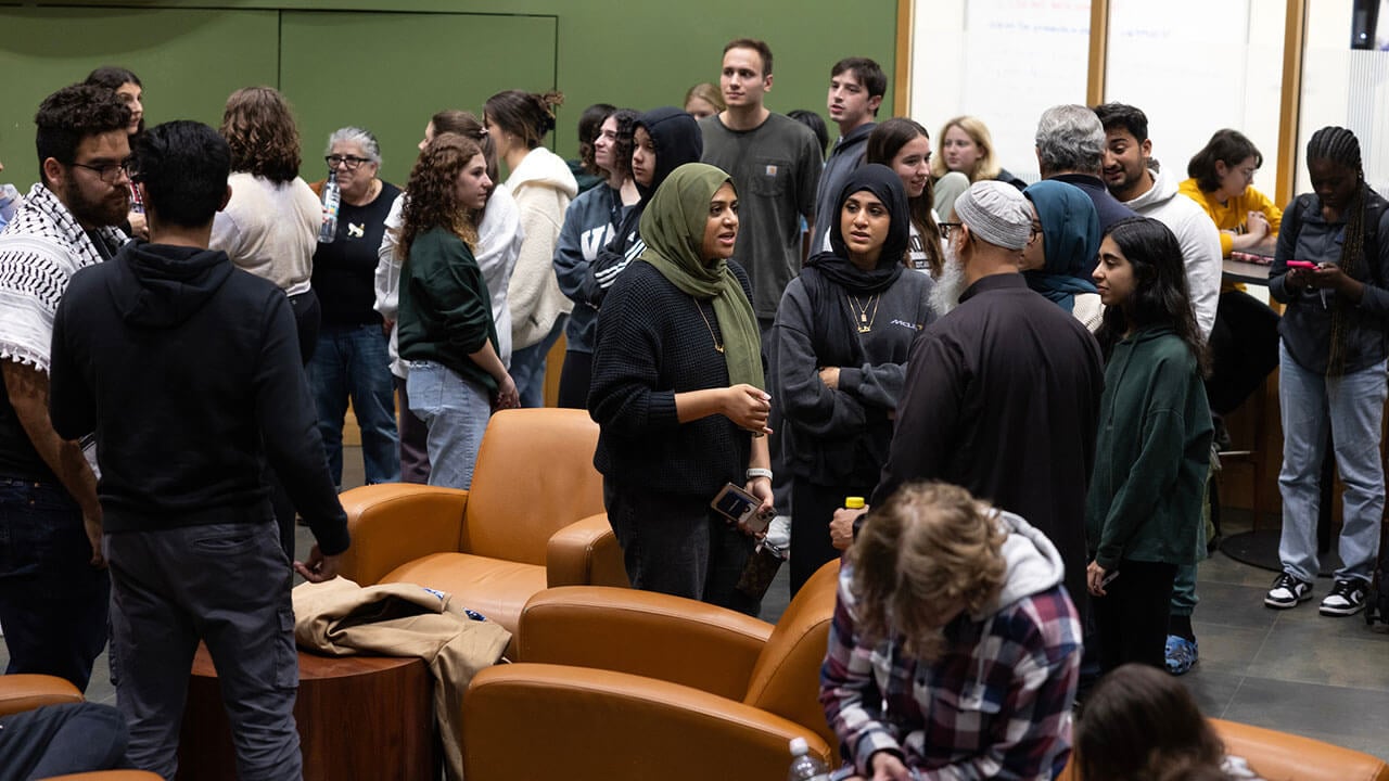 Students participate in a community discussion in the Piazza.