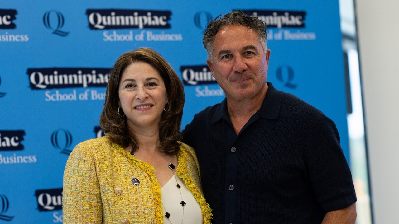 Holly Raider (left) and Chuck Saia (right) smiling at Trailblazers' speaker series.