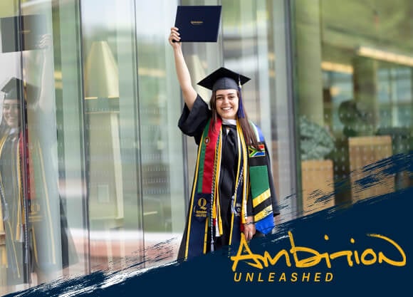 Ambition Unleashed: Gabriela Alvares wears her cap and gown and holds up her diploma in celebration