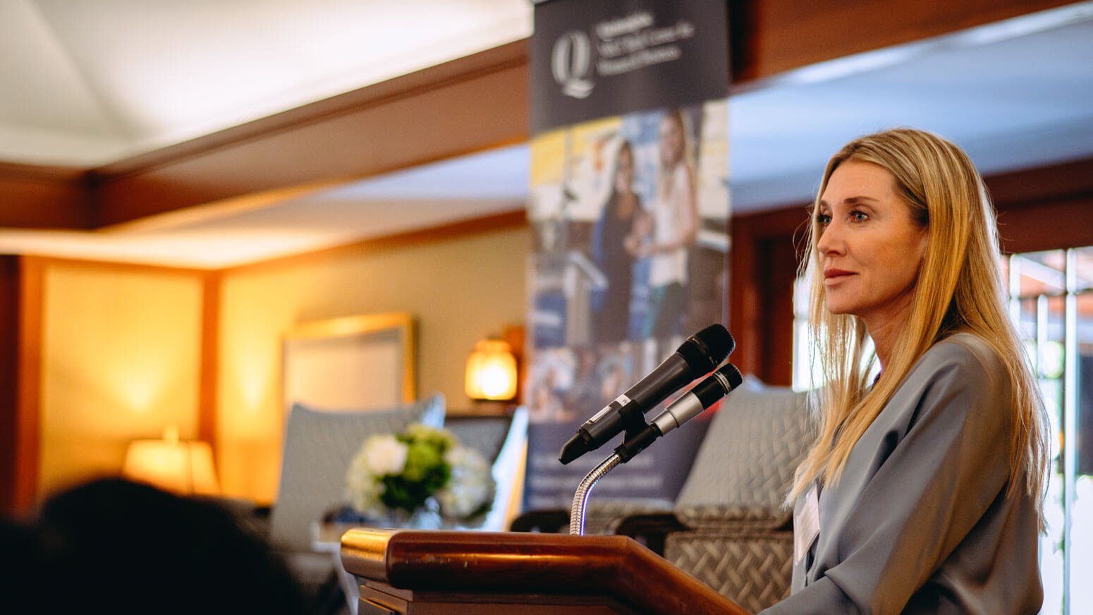 Jessica Geis speaking at a podium