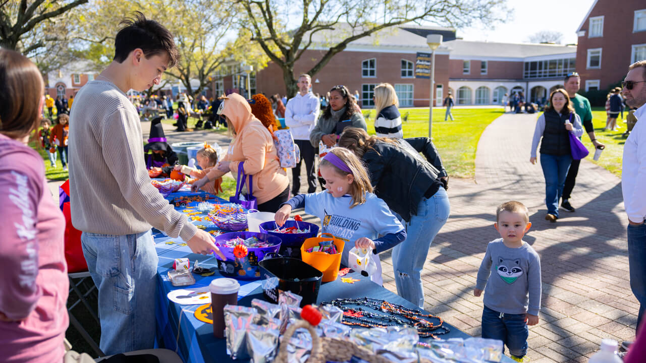 People pick up candy from a table