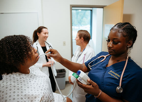 Nursing student works in the Medicine, Nursing and Health Sciences building