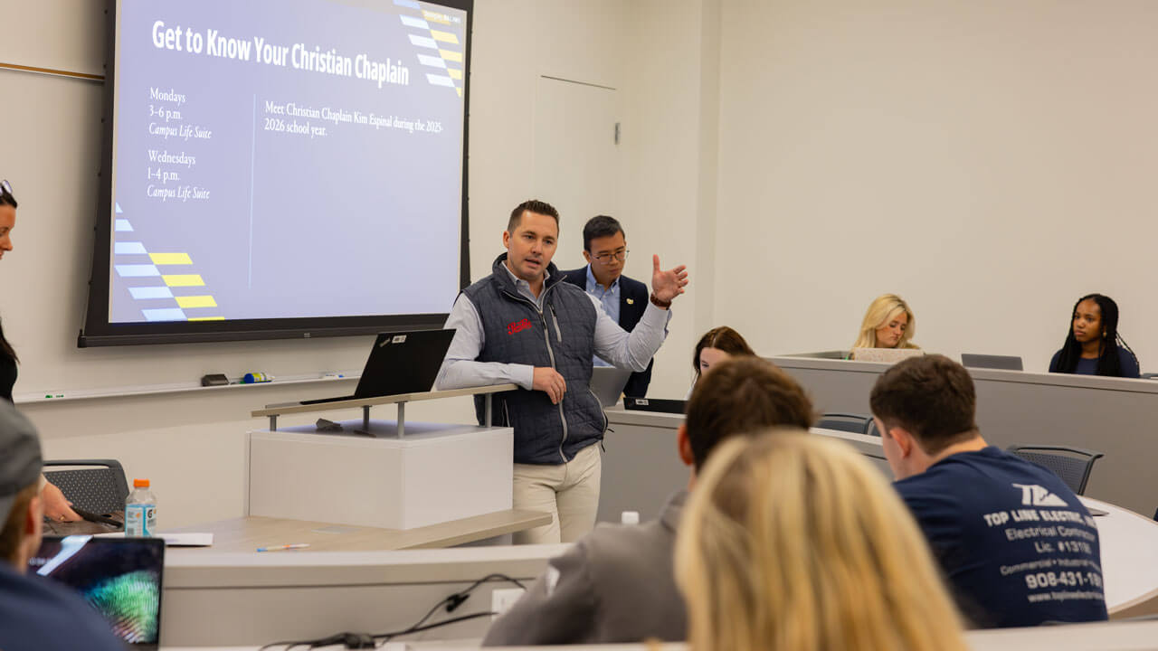 Speaker presents to a classroom of students