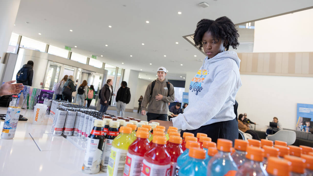 Student explores pepsi products on display