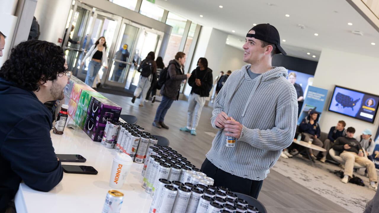 Student explores pepsi products on display