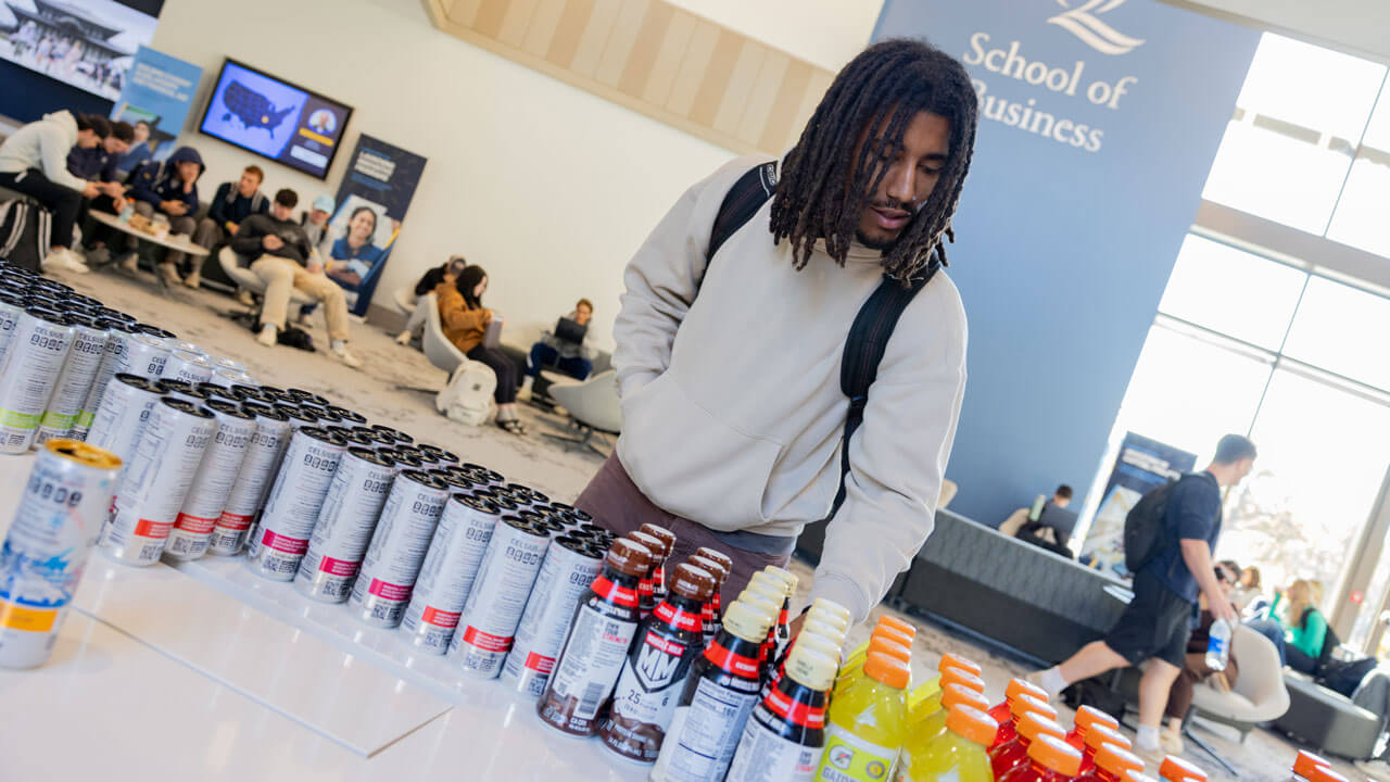 Student explores pepsi products on display