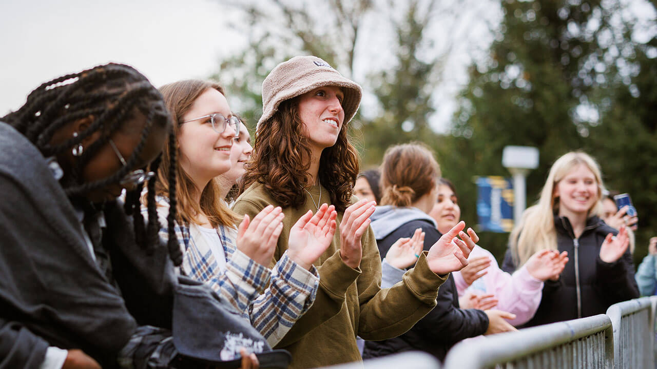 Fall Fest attendees in the crowd watching the Peach Tree Rascals