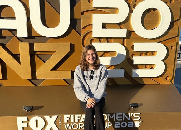 Jacqueline Ydrovo standing in front of Fox News sign