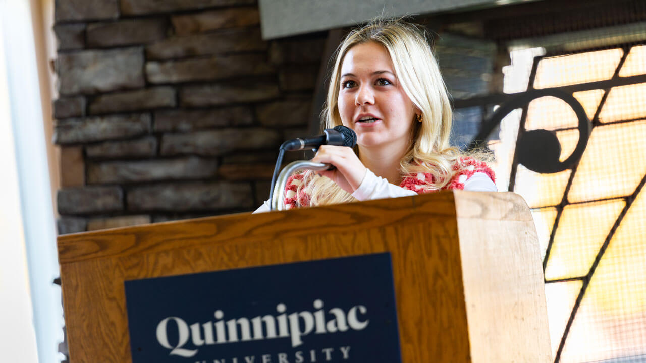 Presenter speaking to a crowd at the indigeneity initiative teach in