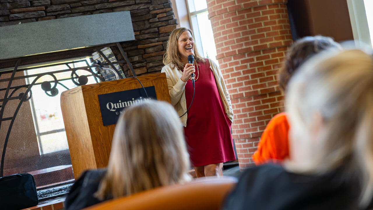 Speaker smiling at audience