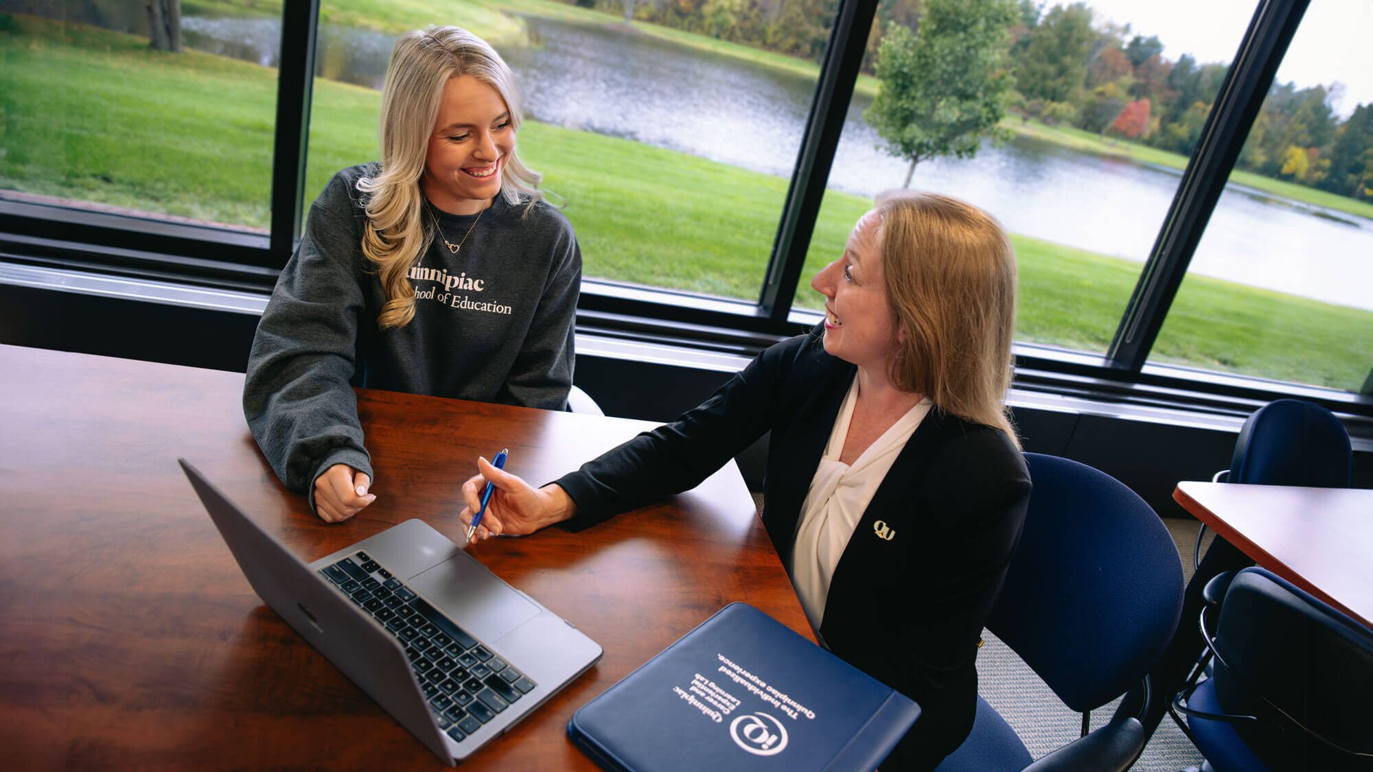 A Quinnipiac School of Education student works with an academic advisor.