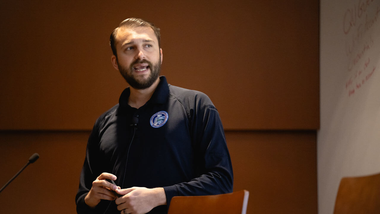 Presenter speaks on stage