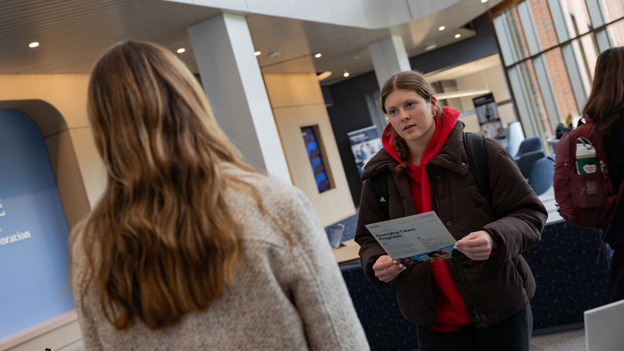 Student holding a Boehringer Ingelheim pamphlet