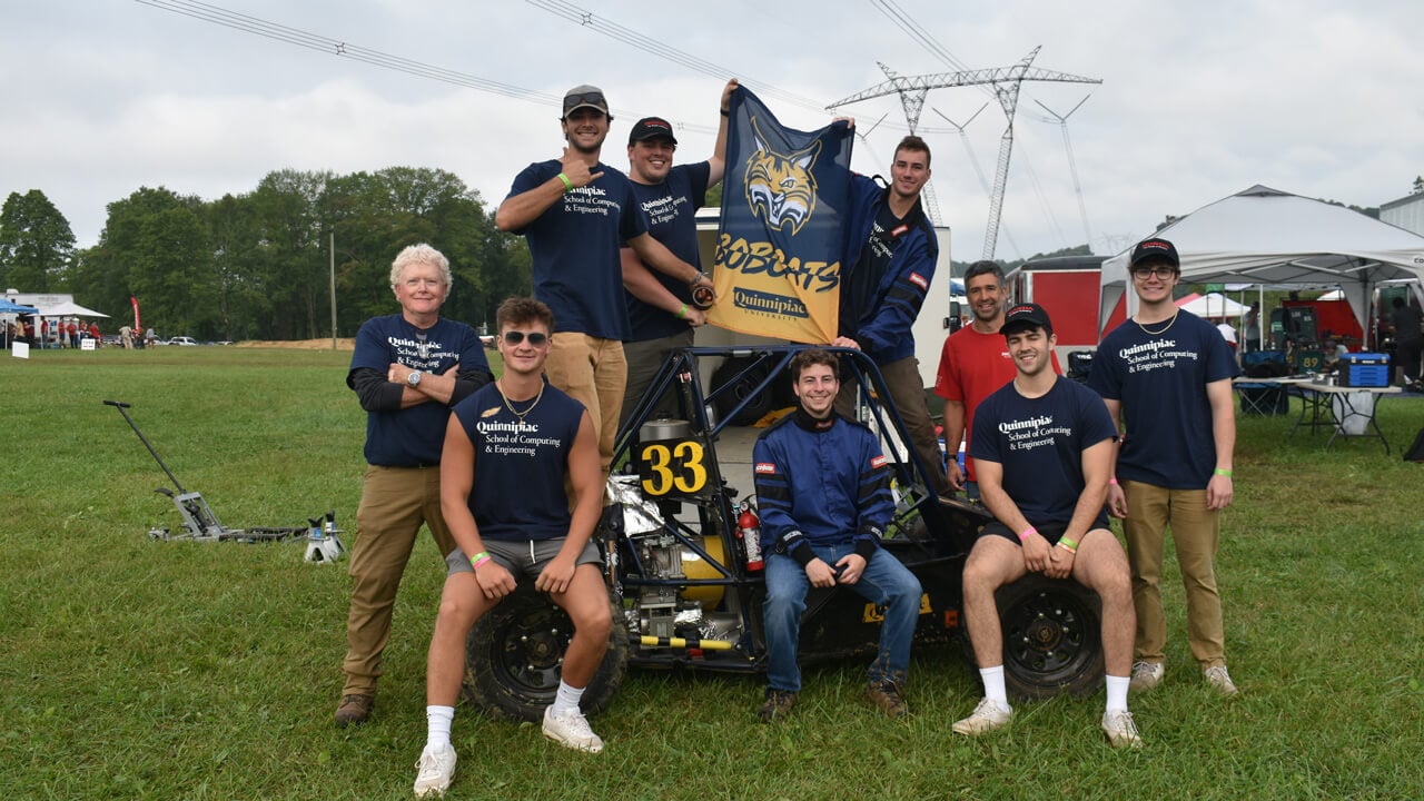 The Baja project team posing with the vehicle