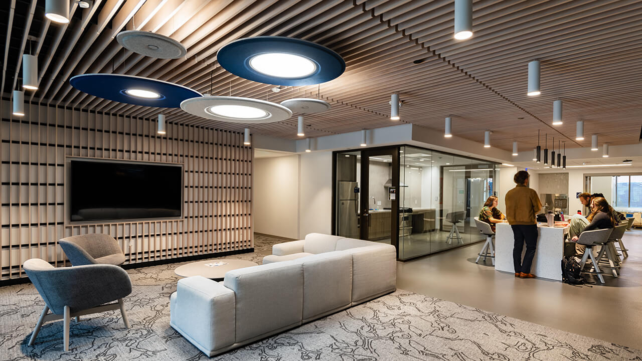 Students sit in the lounge and dining area in The Grove
