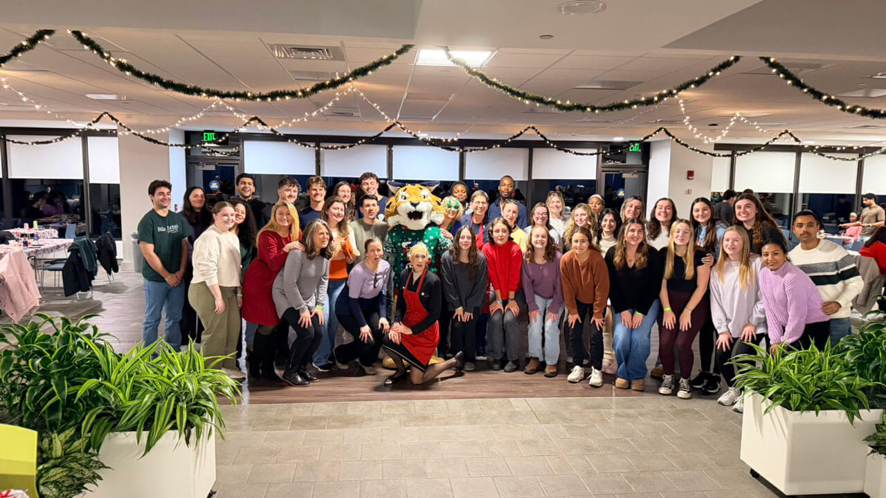 All students pose with boomer