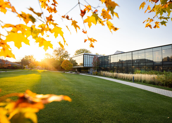 Sun shining on the RecWell Center on a bright, fall day