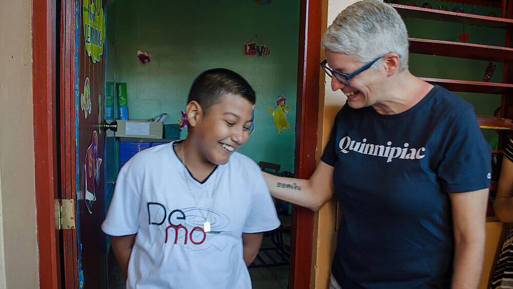 Professor Margarita Diaz speaks with a Nicaraguan boy