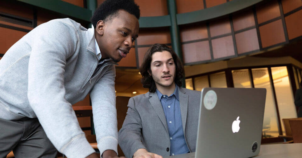 Two graduate students study on the Quinnipiac North Haven Campus