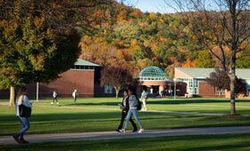 Students walk across the Mount Carmel Campus quad