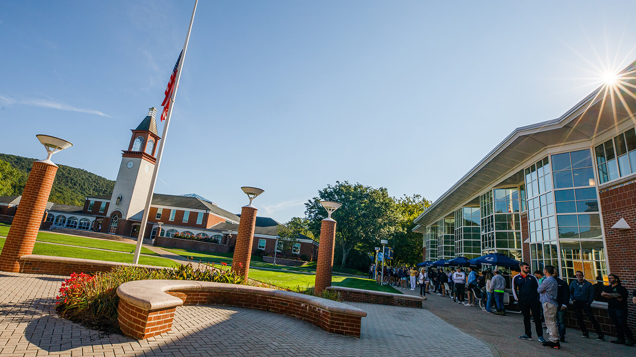 Students and faculty gather on the Quad.