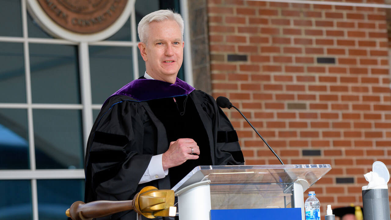 Justice Andrew McDonald speaks at the podium