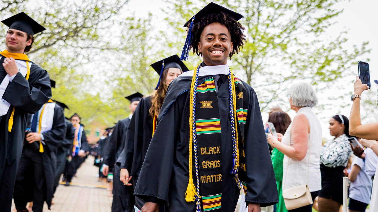 Graduates walk to their seats for the Commencement Ceremony