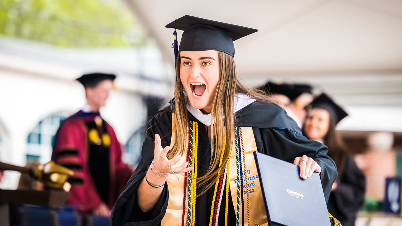 Graduate Shannon Flaherty roars and does the Quinnipiac bobcat swipe