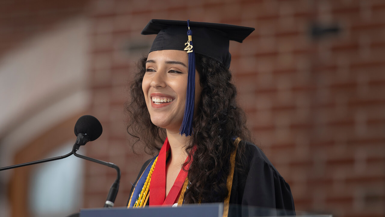 Gabriella Colello speaks at a podium during Commencement