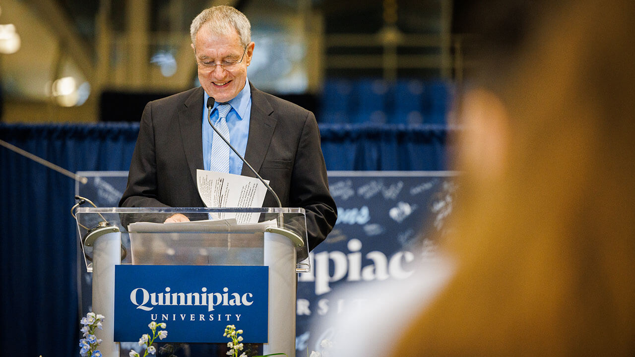 Faculty member speaks to the Class of '22