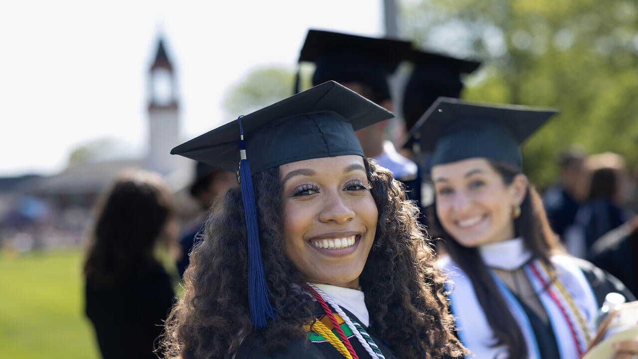 Zoomed in shot of graduate happily grinning