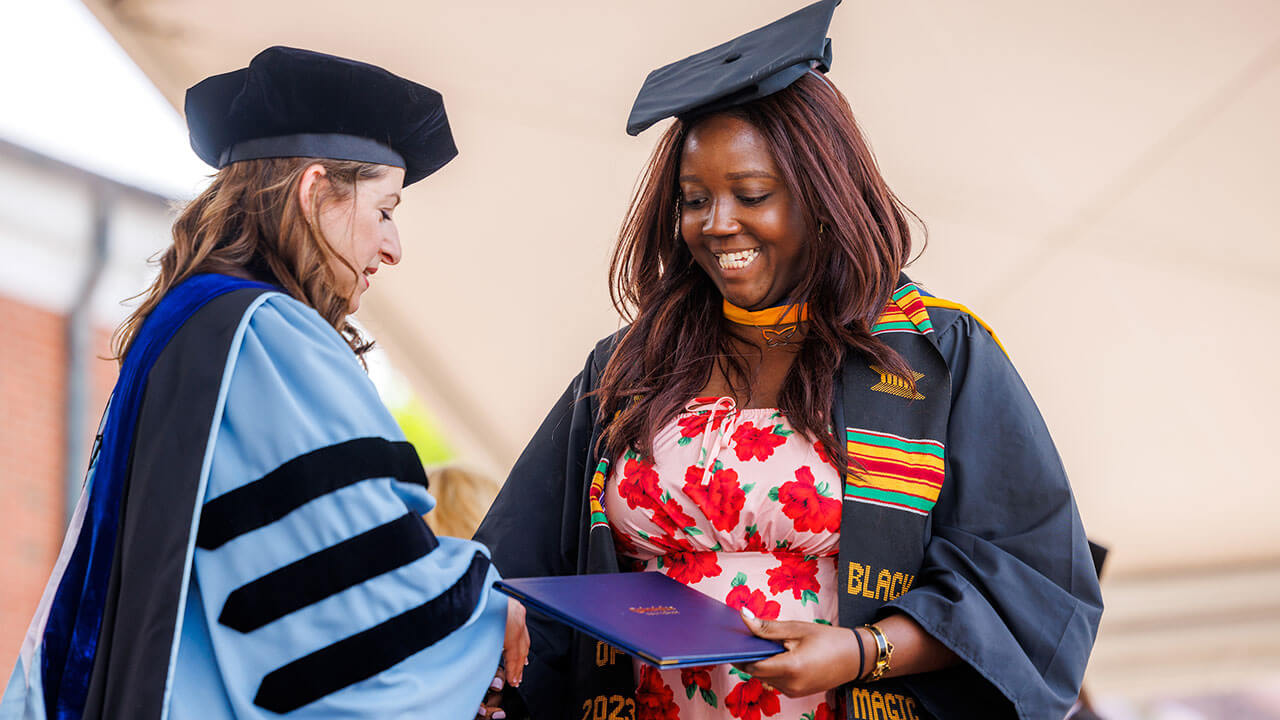 Graduate received her diploma on stage