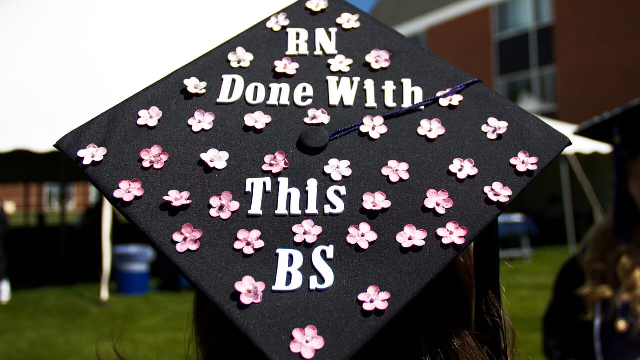 Graduation cap reads 