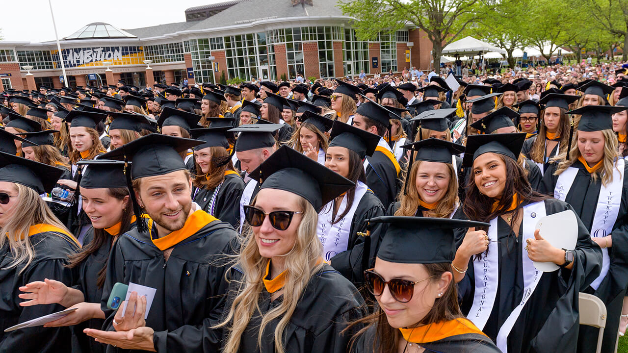 Graduates seated during the College of Health Sciences in the crowd