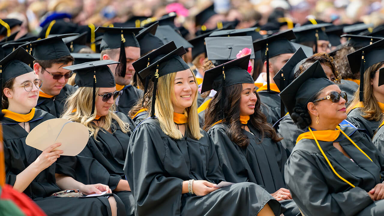 Graduates are seated in rows prior to receiving their diplomas