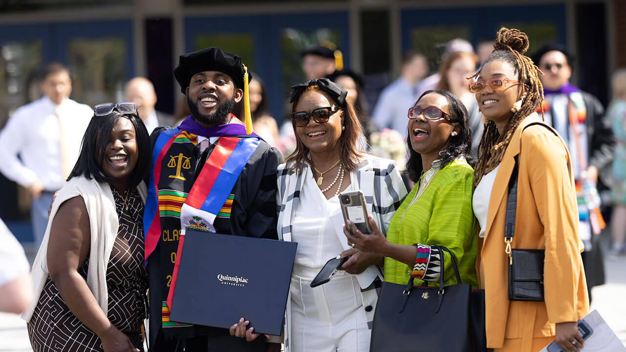 Law graduate student smiling with his family