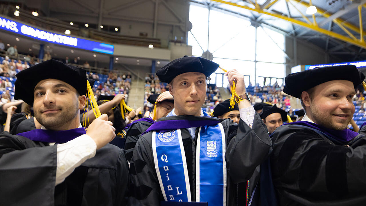 Law graduates flipping their tassels