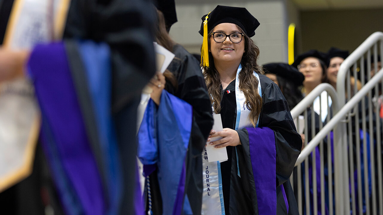 Dozens of graduates file into ceremony