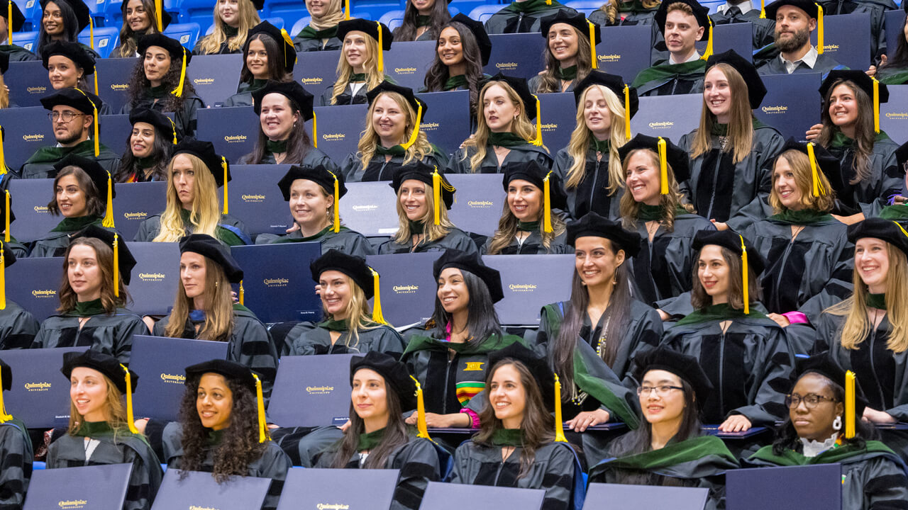 Rows and rows of medical graduates pose for a group photo