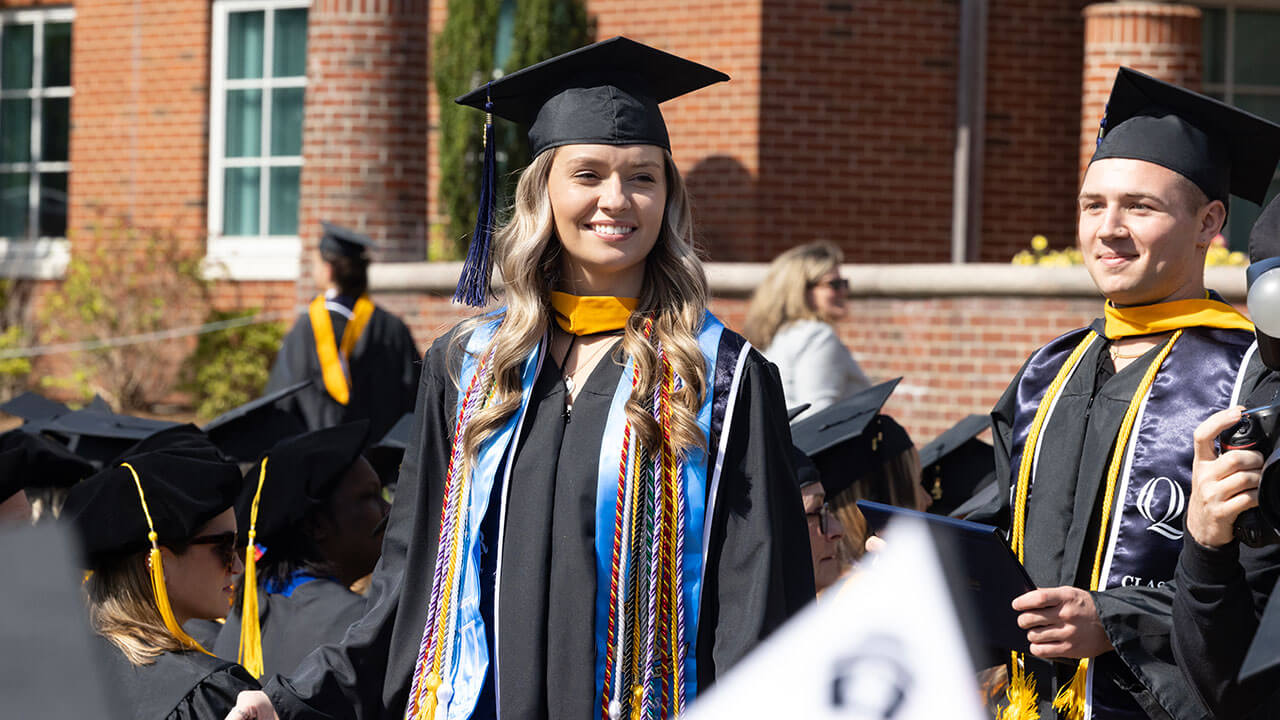 female graduate smiling broadly