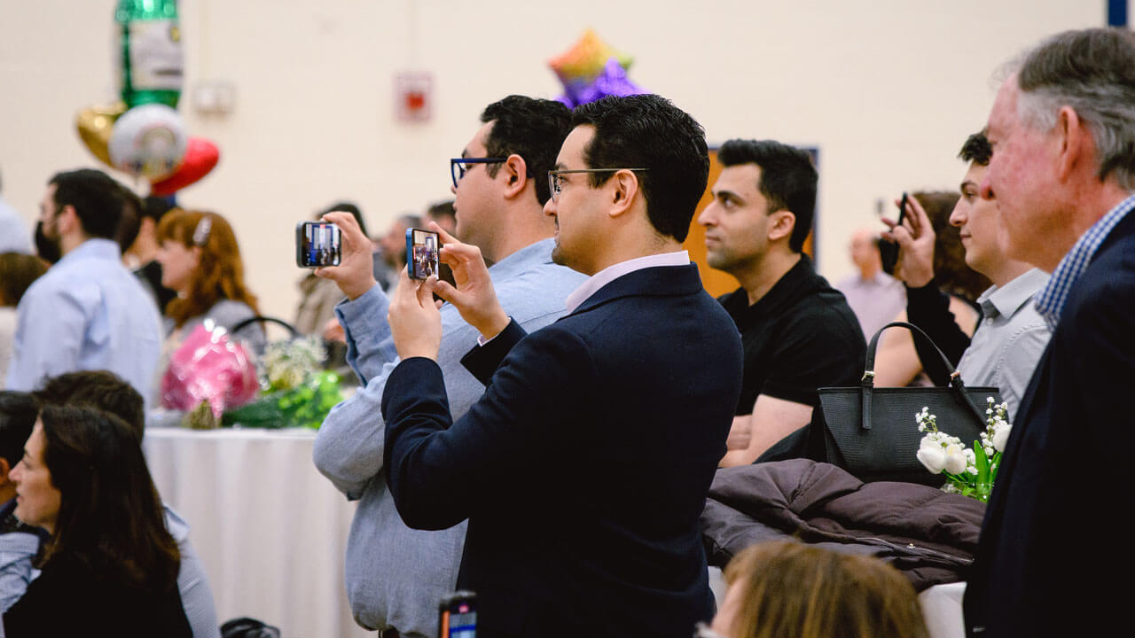 Family members filming match day ceremony