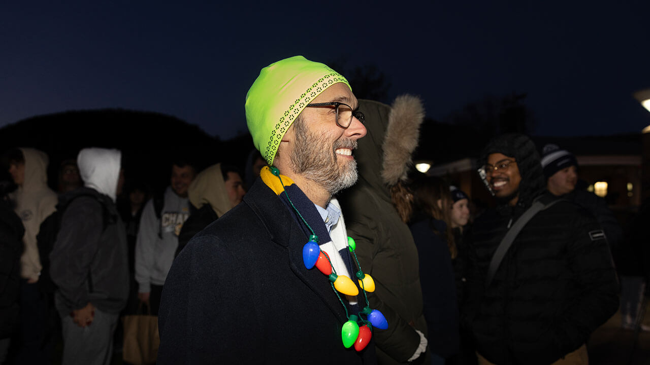 Quad lighting attendee decked out in holiday spirit wear