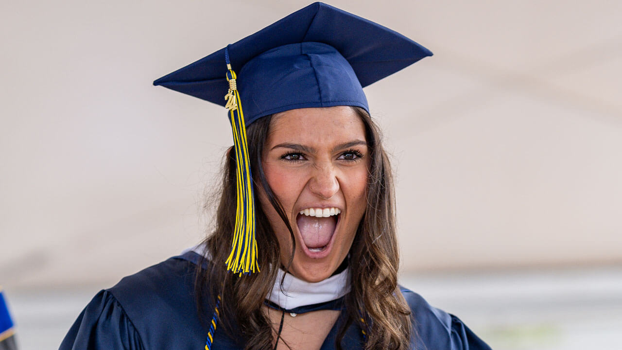 Graduate excited and screaming on stage